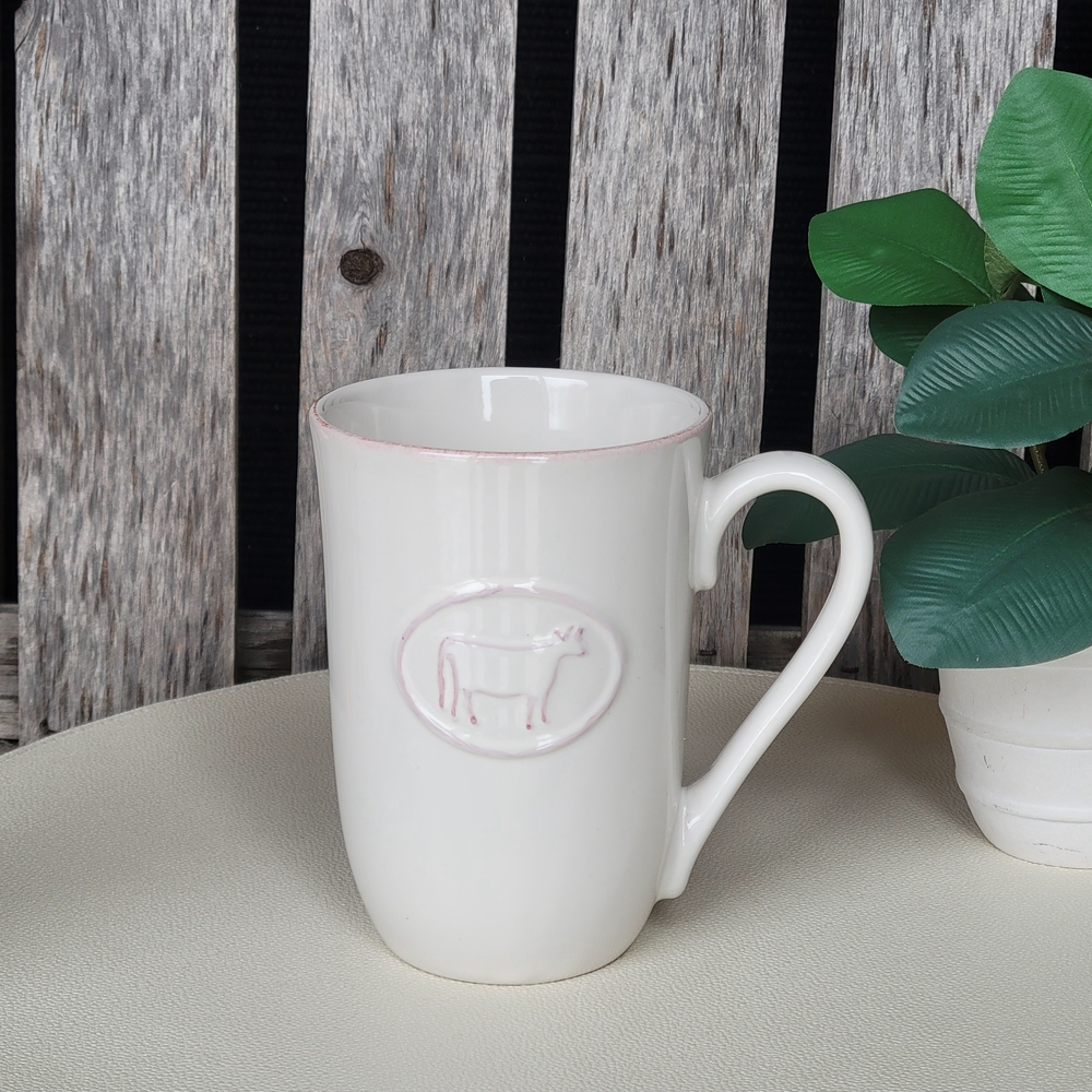 Chic White Mug with Embossed Cow Design